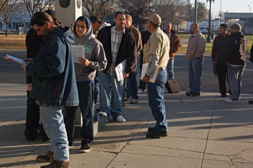 Men and women looking for work line up outside the Stockton Memorial Civic Auditorium for information about possible jobs in the construction trades. (Business Journal photo by Elizabeth Stevens)